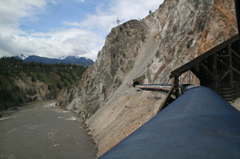 Rocky Mountaineer passing Avalanche Alley next to the Fraser River