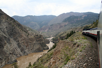 Rocky Mountaineer climbing hard next to the Fraser Canyon