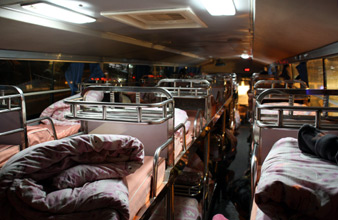 Inside the Kunming sleeper bus:  Berths are a bit short for taller travellers...