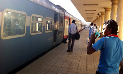 Boarding a daytime train from Luxor to Cairo at Luxor station
