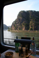 The famous Lorelei Rock on the Rhine, seen from the restaurant car of the Auto Slaap Trein to Italy...