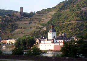 Rhine castles, seen over dinner from the motorail train...