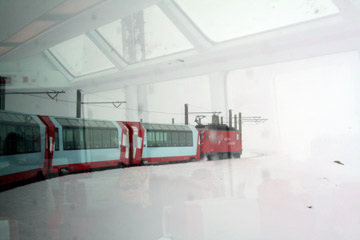 The Glacier Express climbs through a whiteout in the Oberalp pass...