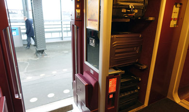 Luggage on Thalys goes on the racks just inside the door.