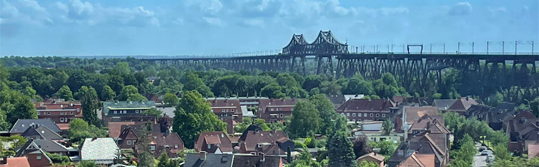 Hamburg to Copenhagen train approaches the Rendsburg Bridge