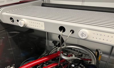 Luggage rack with cable locked with an NFC card