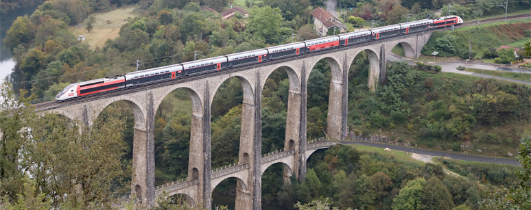 A Paris-Geneva TGV-Lyria crosses the Cize-Bolozon viaduct